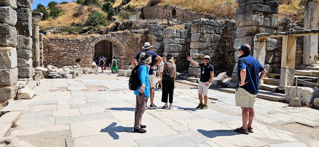 People exploring ancient ruins.