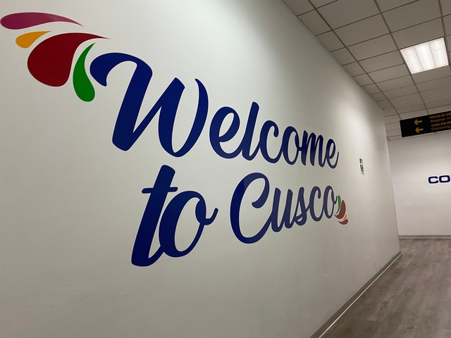Large welcome sign for Cusco on a wall