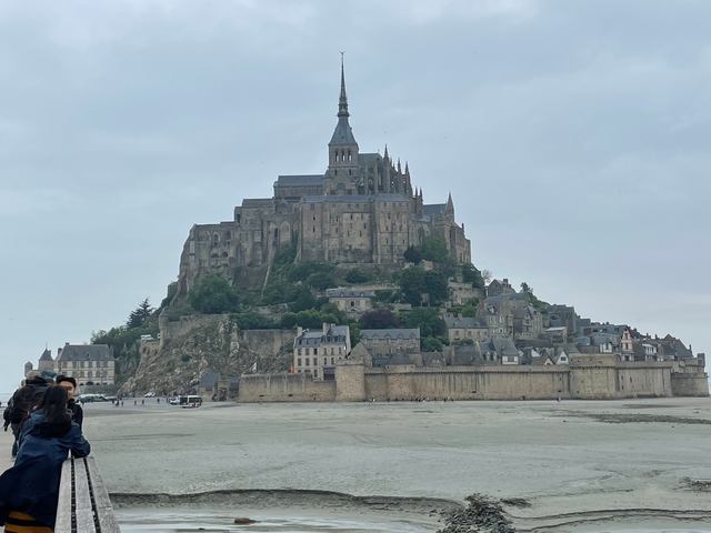 Medieval abbey on an island at low tide.