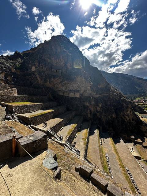 Ancient terraces with people exploring.
