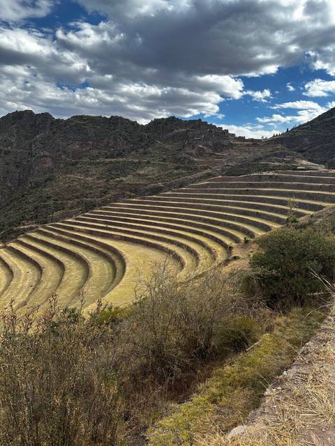 Agricultural terraces in a mountainous landscape.