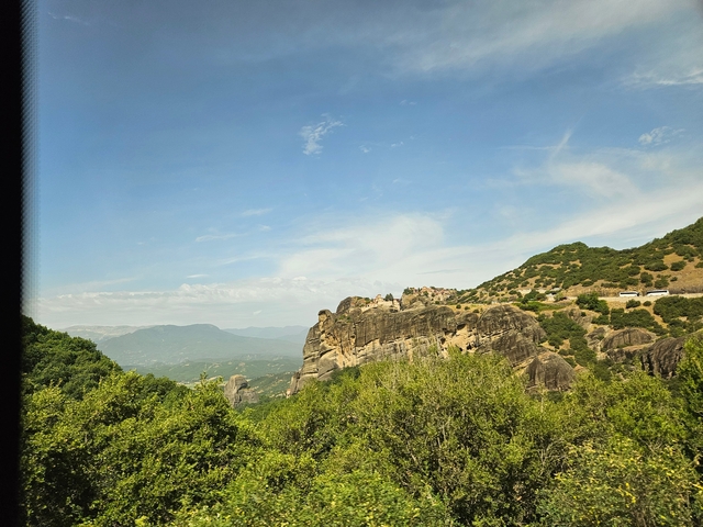       Rocky landscape with large formations and a scenic view.
  