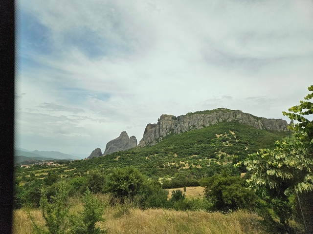       Scenic view of rocky hills in a rural landscape.
  