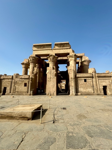       Ancient temple with columns and intricate carvings.
  