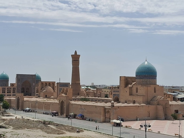       Panoramic view of a historical city with mosques and minarets.
  