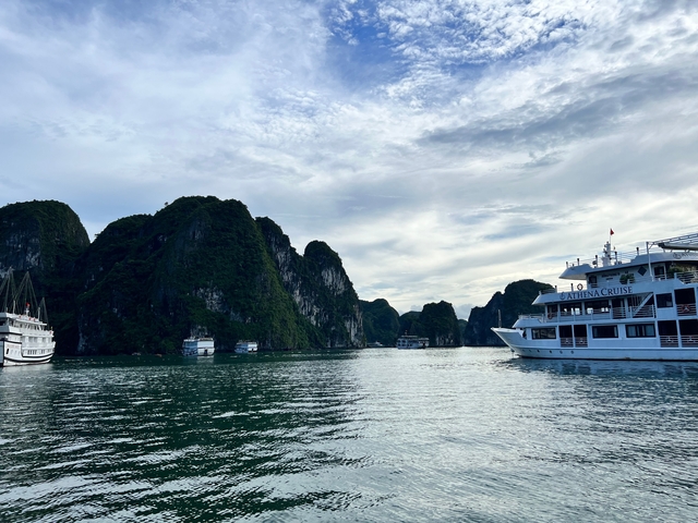 A cruise ship navigating through Halong Bay.