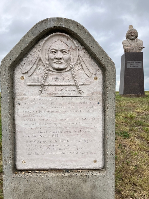 Sitting Bull memorial marker with historical inscription.