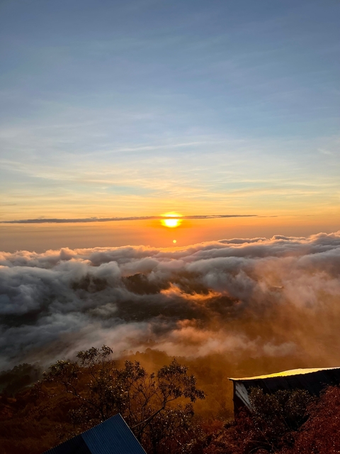 Sunrise view above clouds.