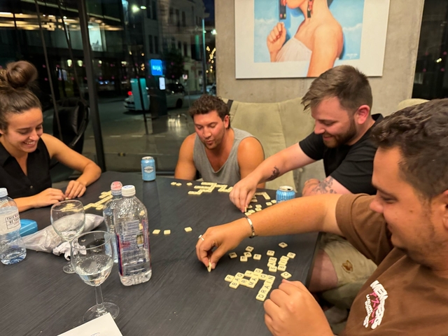 Group playing a board game indoors.