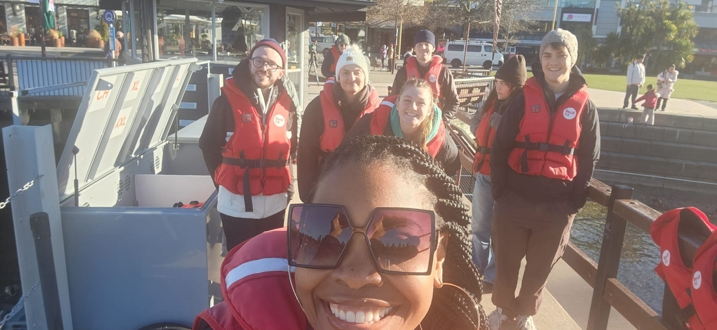       Group of people in life jackets prepared for rafting.
  