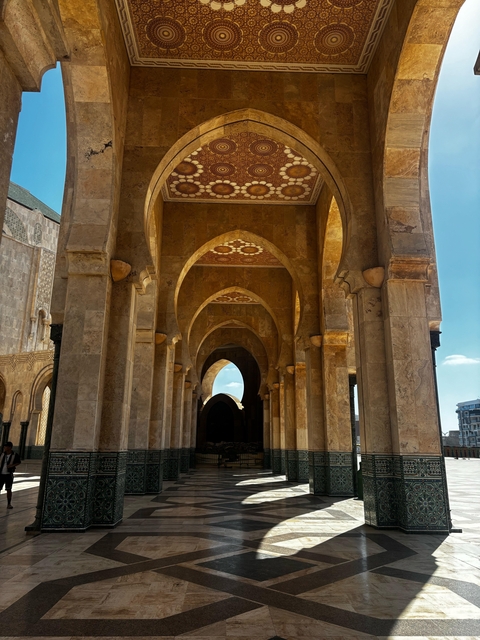 Architectural details of a mosque with arches and columns.