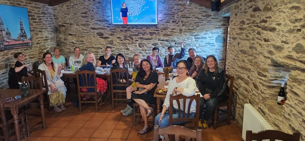 Group dining at a rustic restaurant setting.