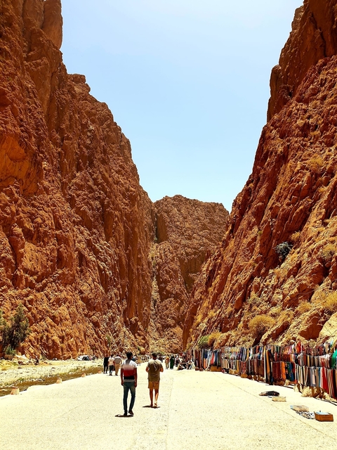       Rocky cliffs with a clear blue sky.
  