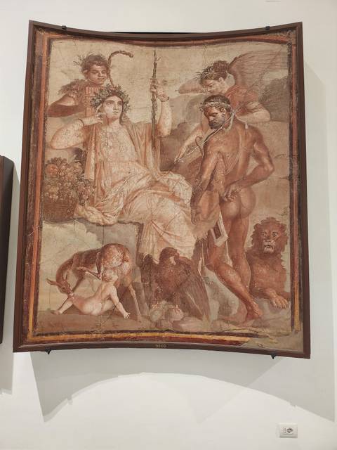 Ancient fresco artwork depicting figures and mythical creatures.