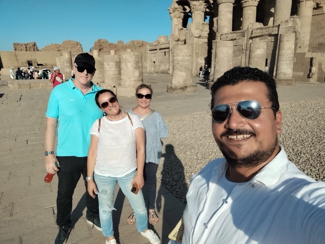 Group selfie in front of ancient ruins.