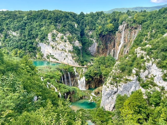       Stunning waterfalls and verdant landscape.
  