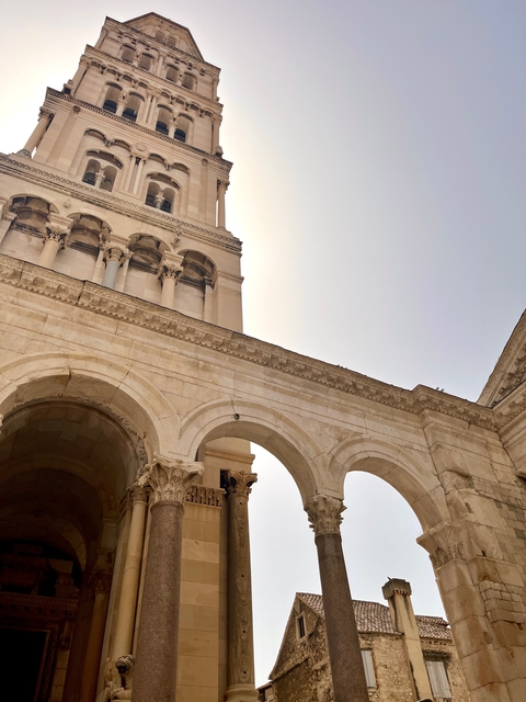       Historic stone arches of a building.
  