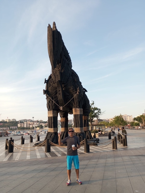       Trojan horse replica with people around.
  