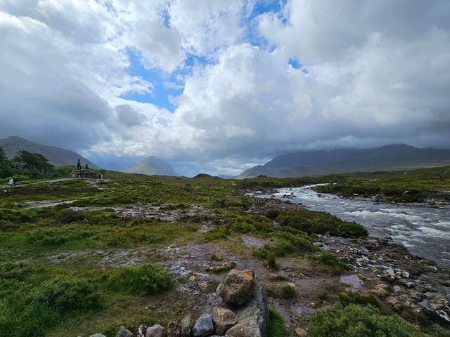       Scenic view of a river with mountains in the background.
  