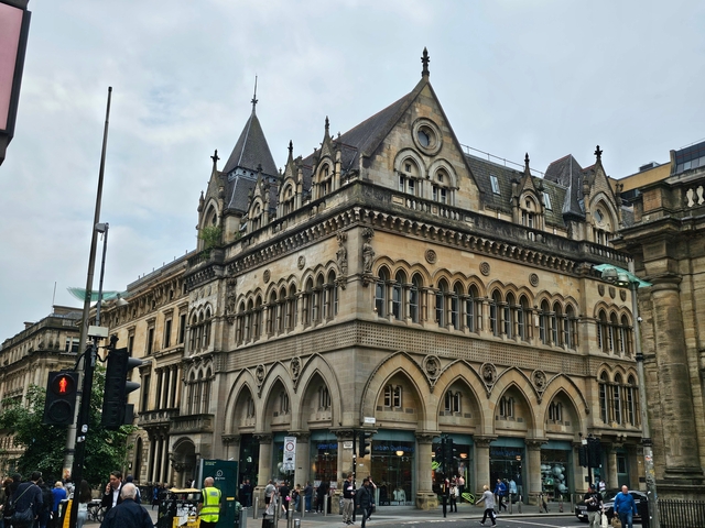       Historic building with ornate architecture in an urban area.
  