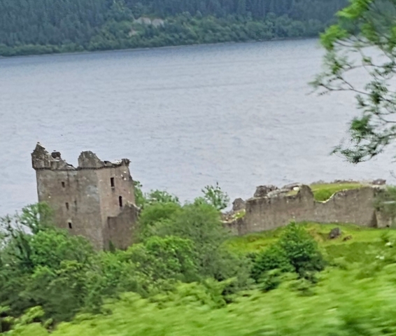       Ruined castle overlooking a lake.
  