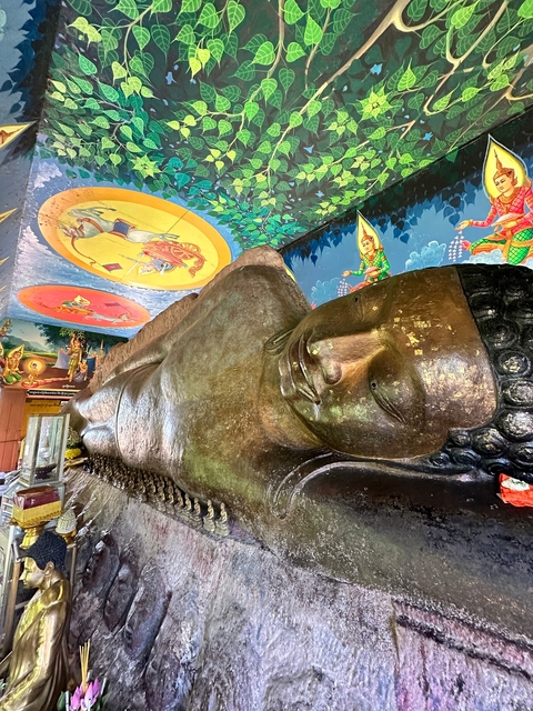 Reclining Buddha statue inside a temple.