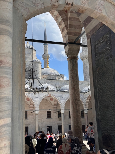 View of iconic mosque with domes and columns.