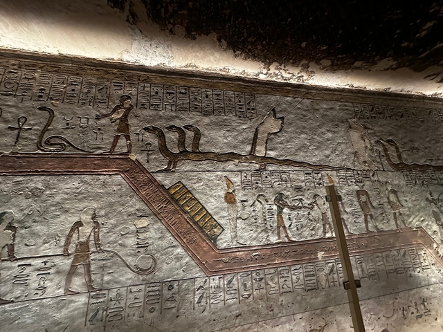       Detailed hieroglyphics and figures on an ancient Egyptian wall.
  