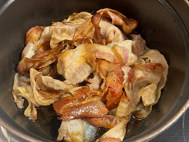 Close-up of fried bacon in a dish.