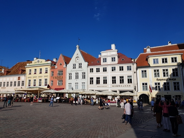       Colorful historic buildings in a bustling square
  