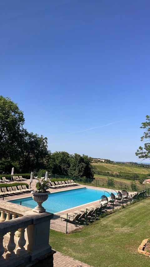 Scenic view of green fields and blue sky.