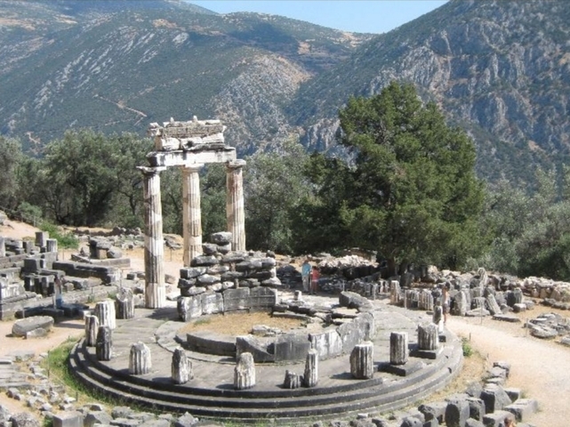       Ancient ruins with mountains in the background
  
