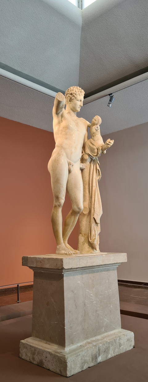 A marble statue in a museum setting