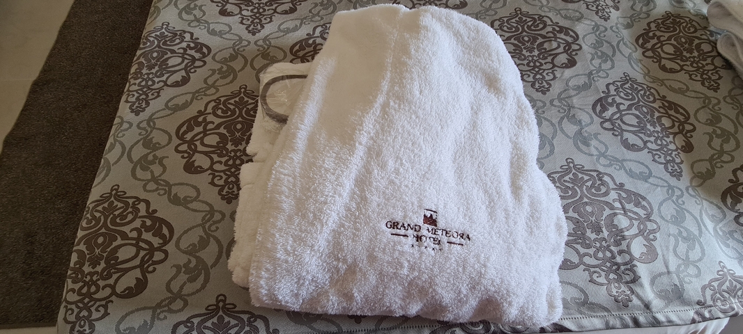       Hotel robe with embroidered text
  