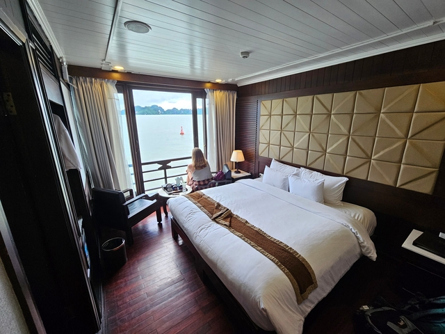       Luxurious hotel room with view of Halong Bay.
  
