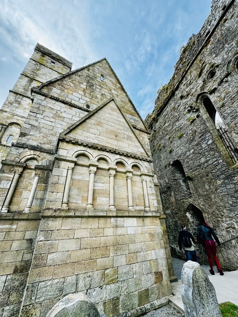       Close-up of stone church architecture with intricate details.
  