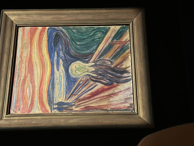       Famous painting 'The Scream' displayed in a museum.
  