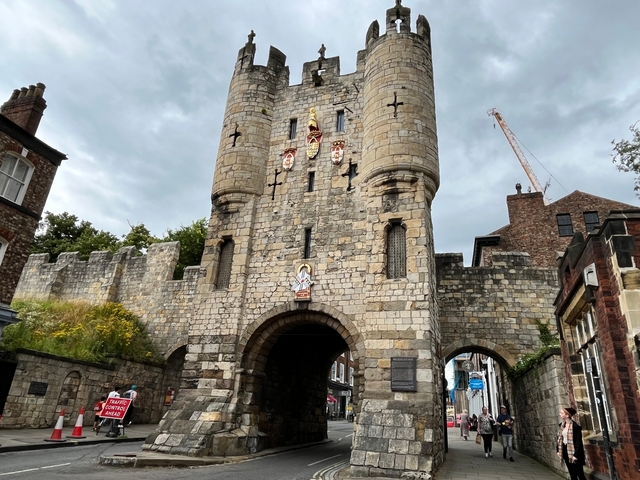       Old stone gateway in a historic town.
  