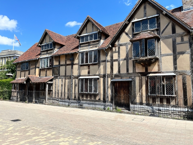      Timber-framed historic house on a sunny day.
  