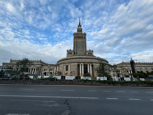       Imposing architectural structure under a cloudy sky.
  