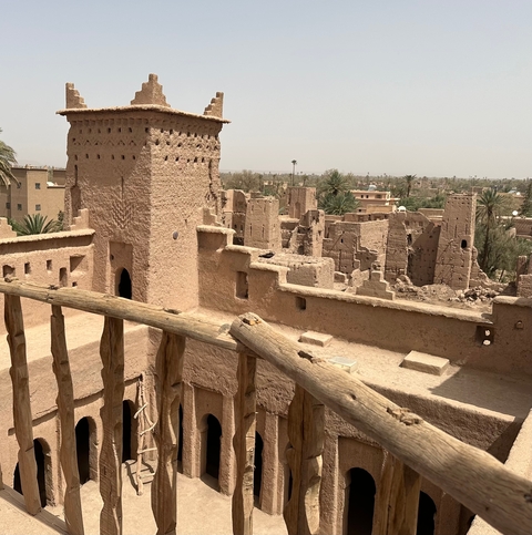       View of ancient clay structures in a desert town.
  