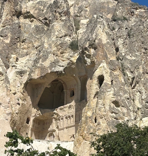 Close-up of a cave dwelling in a rock formation.