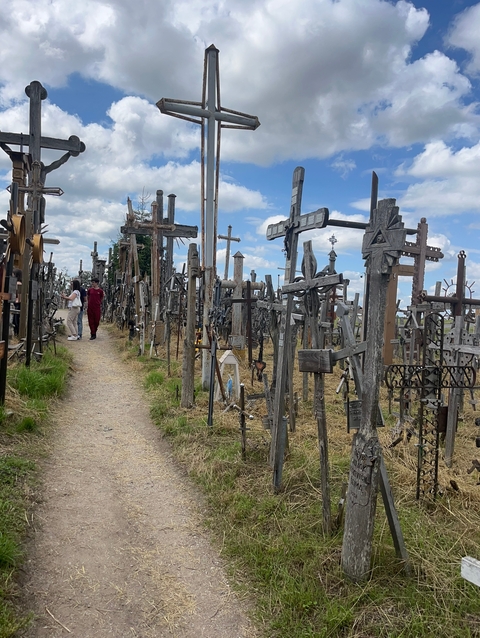 Visitors walking through the Hill of Crosses.