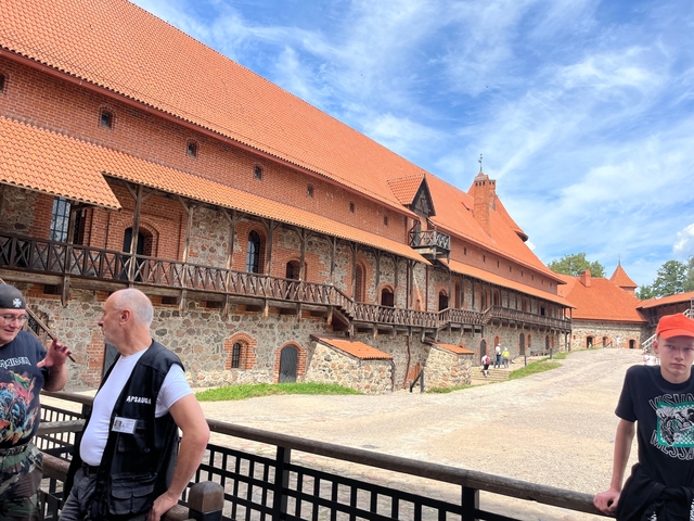 Trakai Castle in Lithuania with visitors nearby.