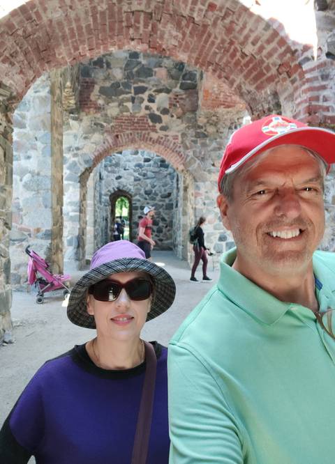Selfie with stone arches in the background.