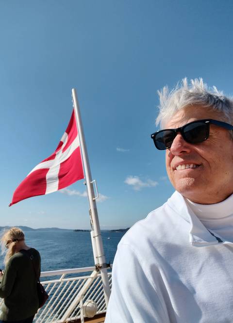 Person with a flag in the background.