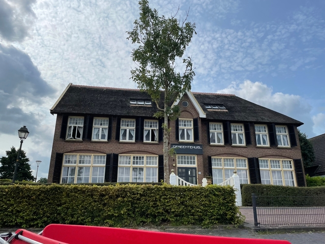 Traditional Dutch building with large windows.