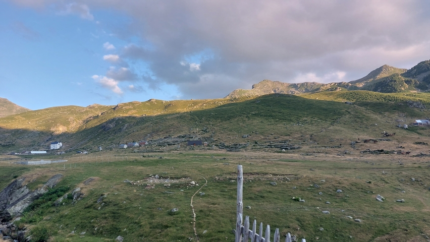 Expansive landscape with mountains in the background.