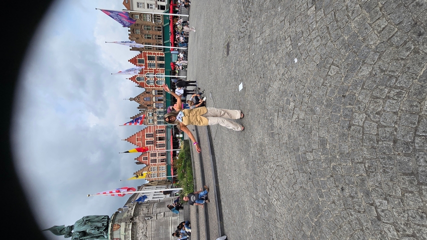       Person posing for a photo in a square.
  