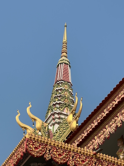       Temple entrance with a clear blue sky.
  
